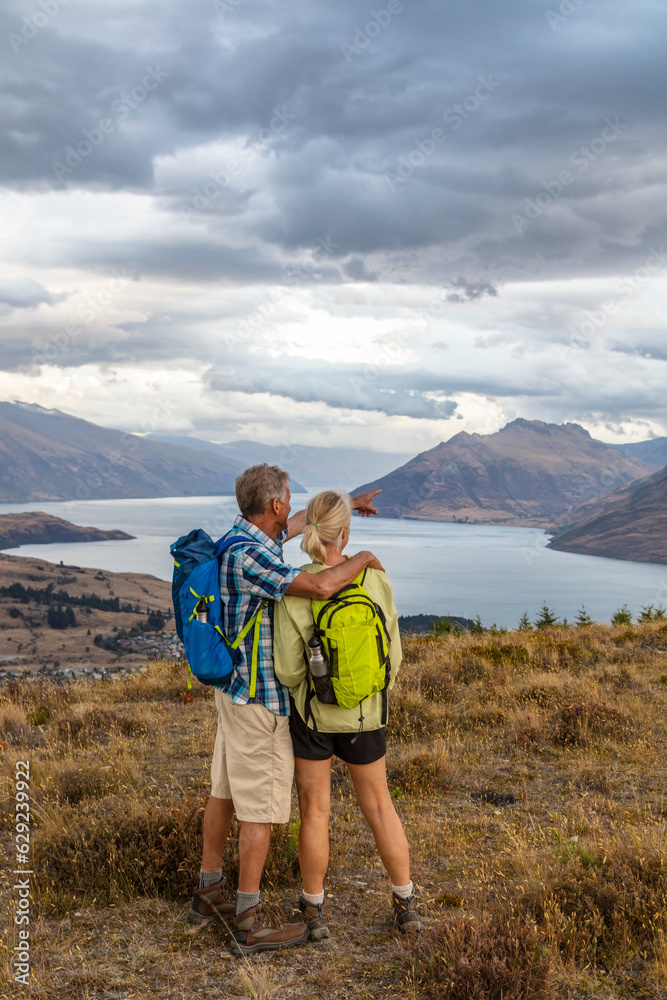 Loving retired couple exploring remote New Zealand landscape