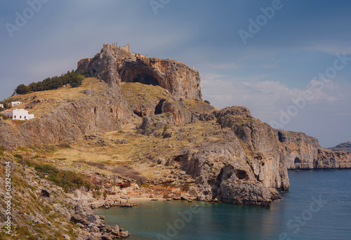 Rhodes, Greece. Lindos small whitewashed village and the Acropolis, scenery of Rhodos Island at Aegean Sea. St. Pauls bay