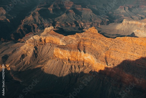 Picturesque view of a rugged sandstone canyon landscape during sunset