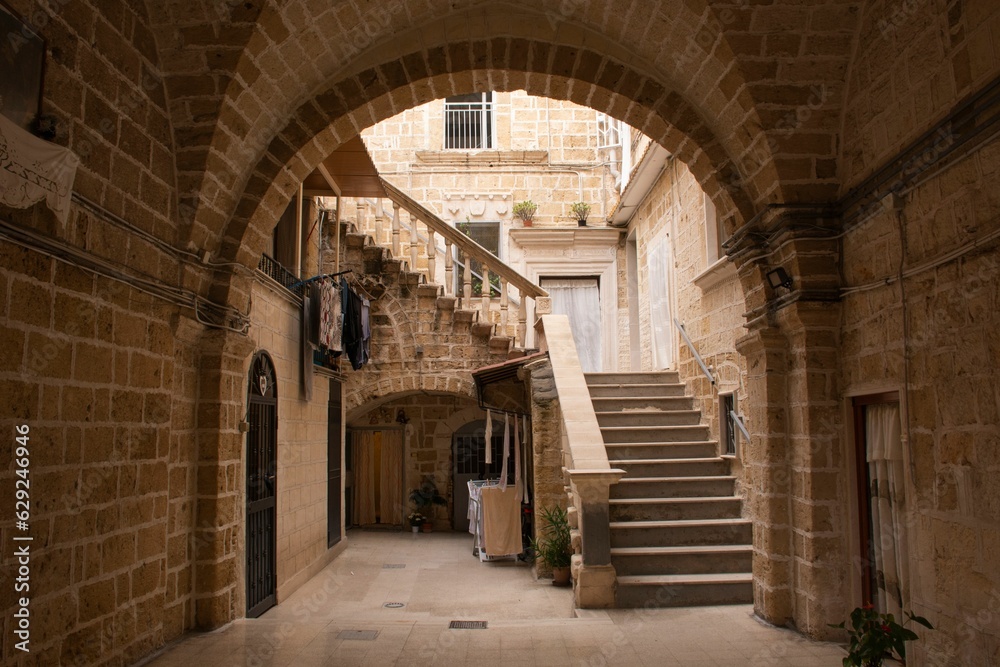 Urban street scene with an old building in Bari, Italy