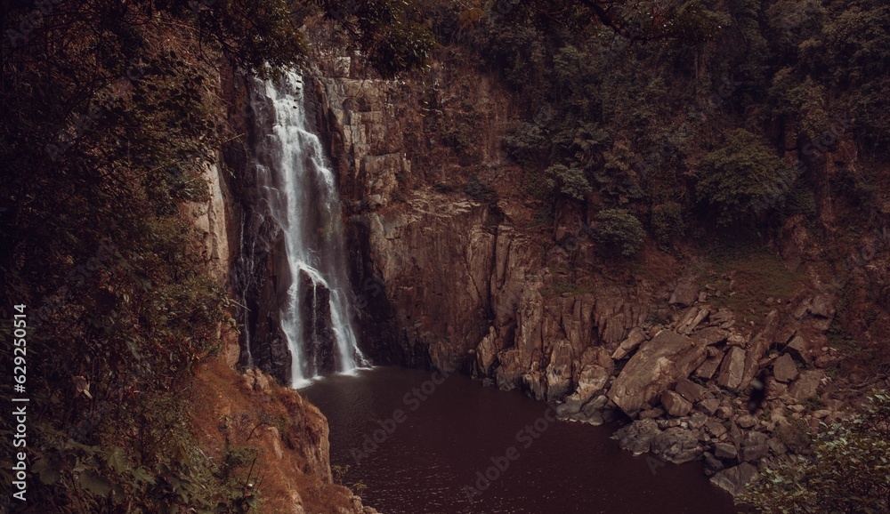 Scenic view of a waterfall located near a forest area in Khao Yai, Thailand