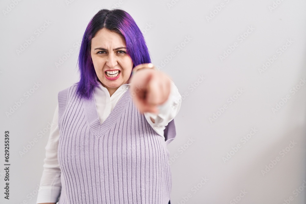 Plus size woman wit purple hair standing over white background pointing displeased and frustrated to the camera, angry and furious with you Plus size woman wit purple hair standing over white background pointing displeased and frustrated to the camera, angry and furious with you