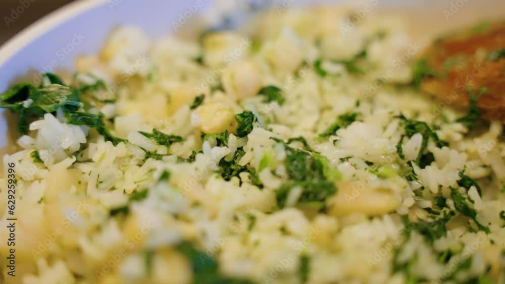 Closeup video of hot boiled rice with herbs and spices Closeup video of hot boiled rice with herbs and spices
