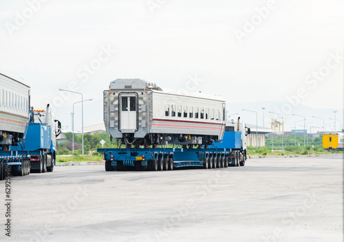 Transport of Oversize Heavy cargo trailera new passenger train on a multi-axle hydraulic modular truck trailer Loading a port area