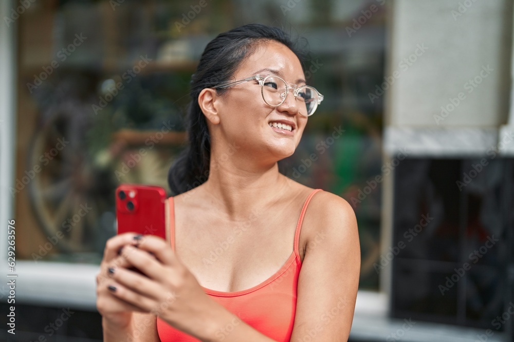 custom made wallpaper toronto digitalYoung chinese woman smiling confident using smartphone at street