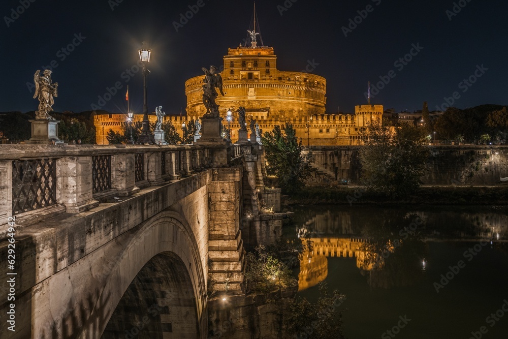 Night view of Castel Sant'Angelo on the bank of the Tiber River in Rome, Italy