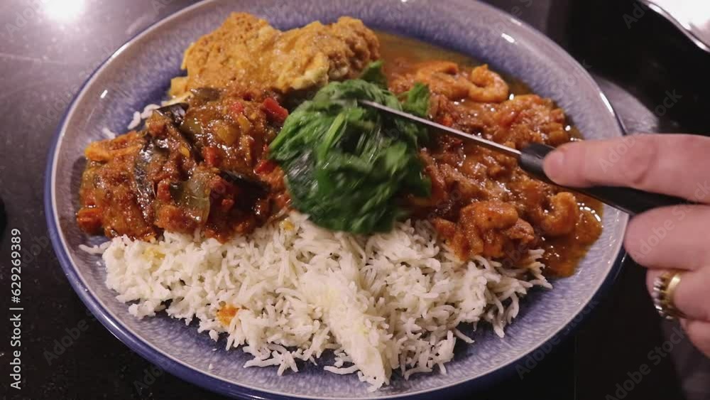 Woman Preparing Indian Cuisine Curry Rice Dish Adding Spinach Clip 1 Woman Preparing Indian Cuisine Curry Rice Dish Adding Spinach Clip 1