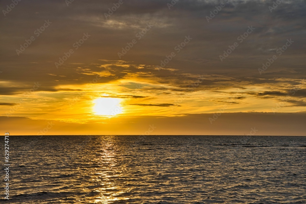 the beautiful sunset over the calm sea