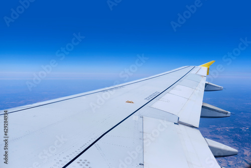 view of aircraft wing as seen from window