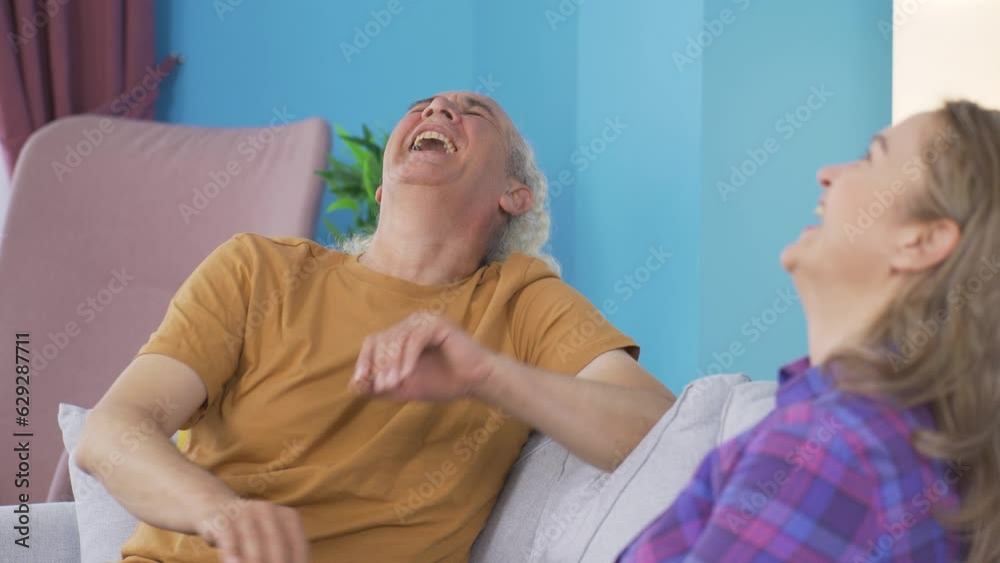 Married couple laughing out loud. Married couple laughing out loud.