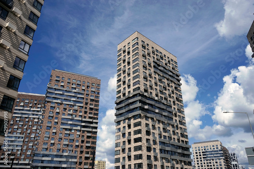 Modern residential high-rise buildings against the blue sky.