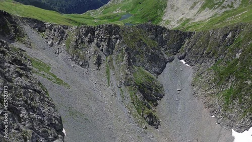 Scenic view from above of Lake Capra near Transfagarasan Mountain Pass in the southern Carpathian Mountains of Romania.