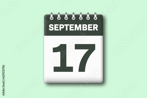 17. September - Die Kalender Illustration zeigt ein Kalenderblatt auf gr?nem Hintergrund. Siebzehnter Tag vom Monat September photo