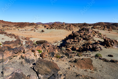 Landscape in the mountains with a volcano. A lifeless desert with lots of rocks and lava remnants