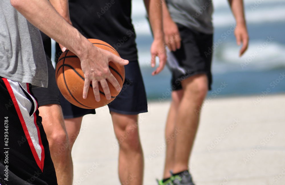 Fototapeta premium Group of people playing street basketball