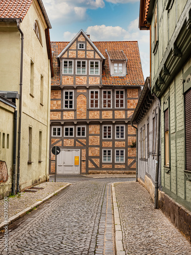 small town with old vintage small colored houses and old cobblestone pavement © Elena