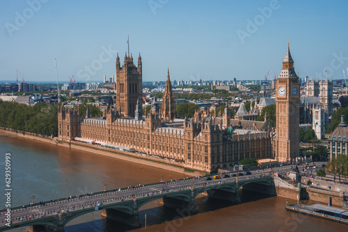 Big Ben, Westminster Bridge on River Thames in London, the UK. English symbol. Lovely puffy clouds, sunny day