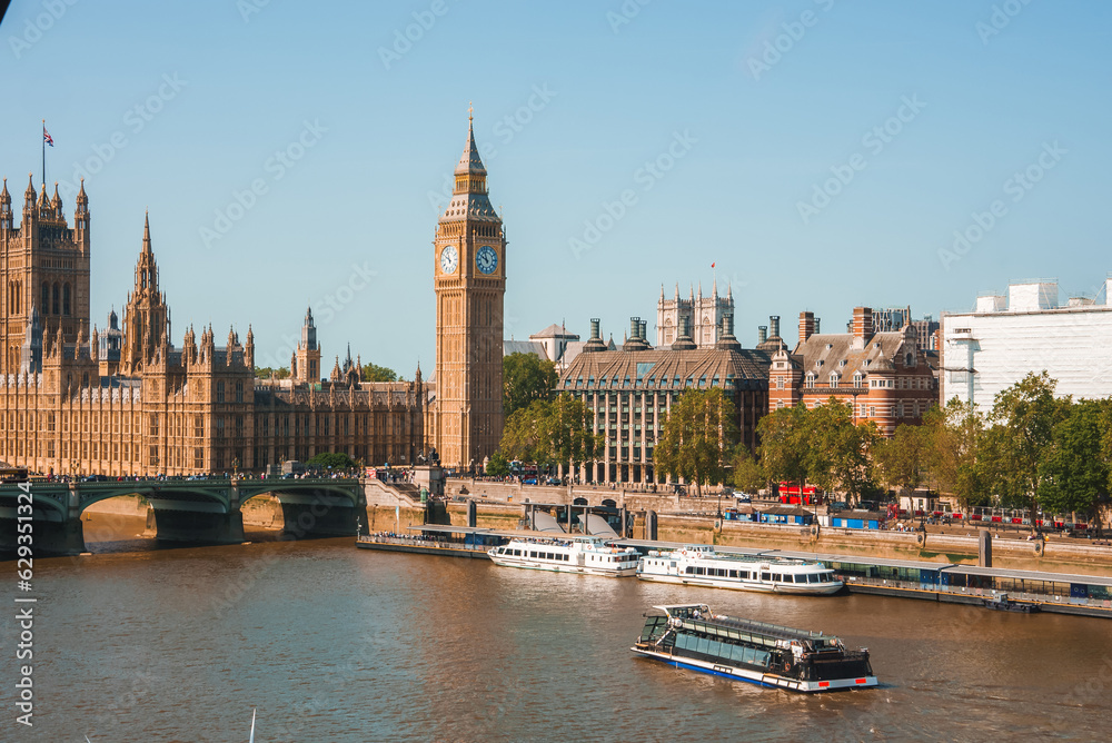 Big Ben, Westminster Bridge on River Thames in London, the UK. English symbol. Lovely puffy clouds, sunny day Big Ben, Westminster Bridge on River Thames in London, the UK. English symbol. Lovely puffy clouds, sunny day