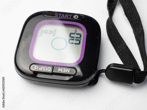 a black digital pedometer, a device for counting steps