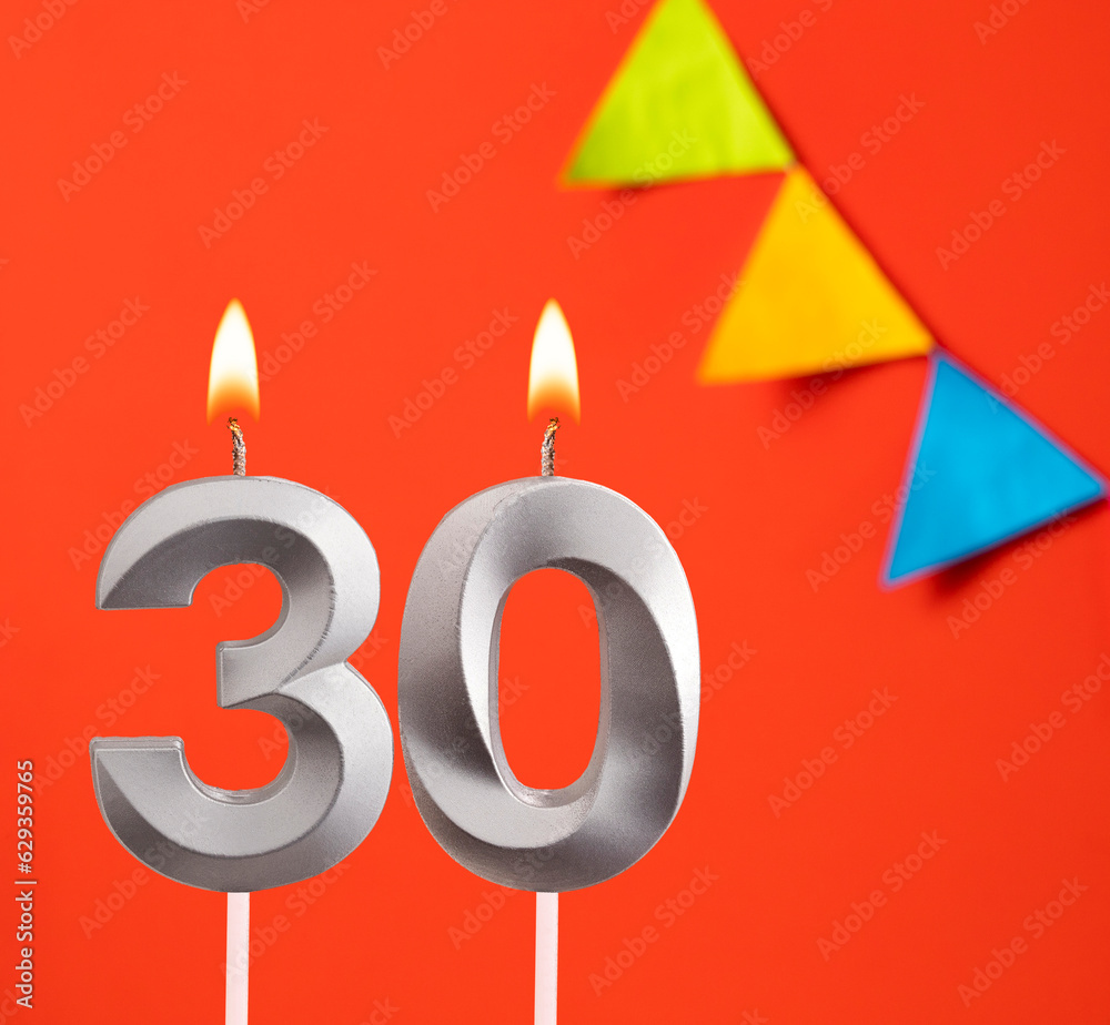 Birthday candle number 30 - Invitation card in orange background Birthday candle number 30 - Invitation card in orange background