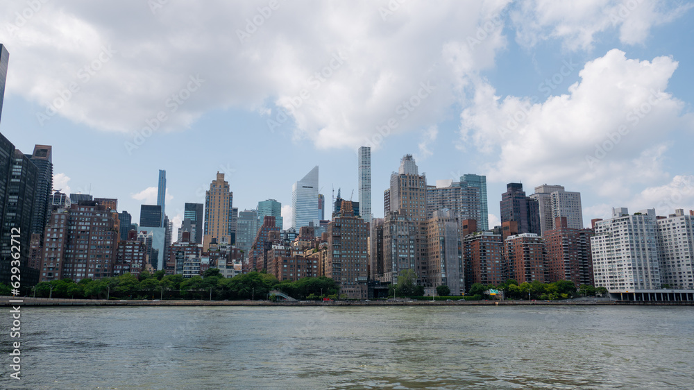 View of Manhattan midtown across the East River with billionaire's row skyscrapers visible in the background. View of Manhattan midtown across the East River with billionaire's row skyscrapers visible in the background.