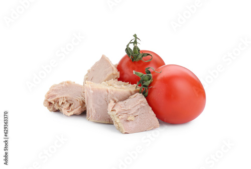 Delicious canned tuna chunks with tomatoes on white background