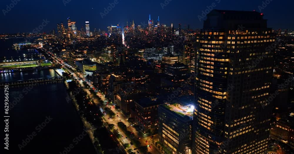 Never sleeping New York at night. Breathtaking cityscape with lively traffic and multiple lights on. Top view.