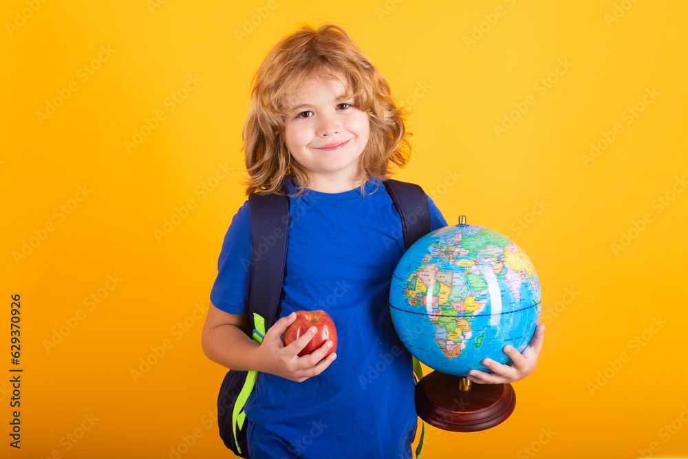School boy world globe and apple. School child 7-8 years old with book go back to school. Little student. School boy world globe and apple. School child 7-8 years old with book go back to school. Little student.