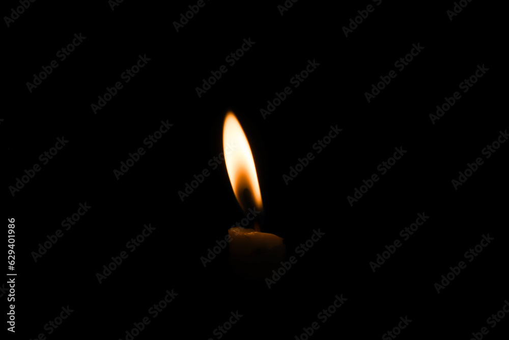 candle flame close up on dark background Melted wax candles that burn at night white candle burning in the dark candlelight
candle flame close up on dark background Melted wax candles that burn at night white candle burning in the dark candlelight