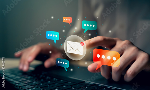 Hand using laptop and touching on digital screen of new email notifications, messages to delivery.