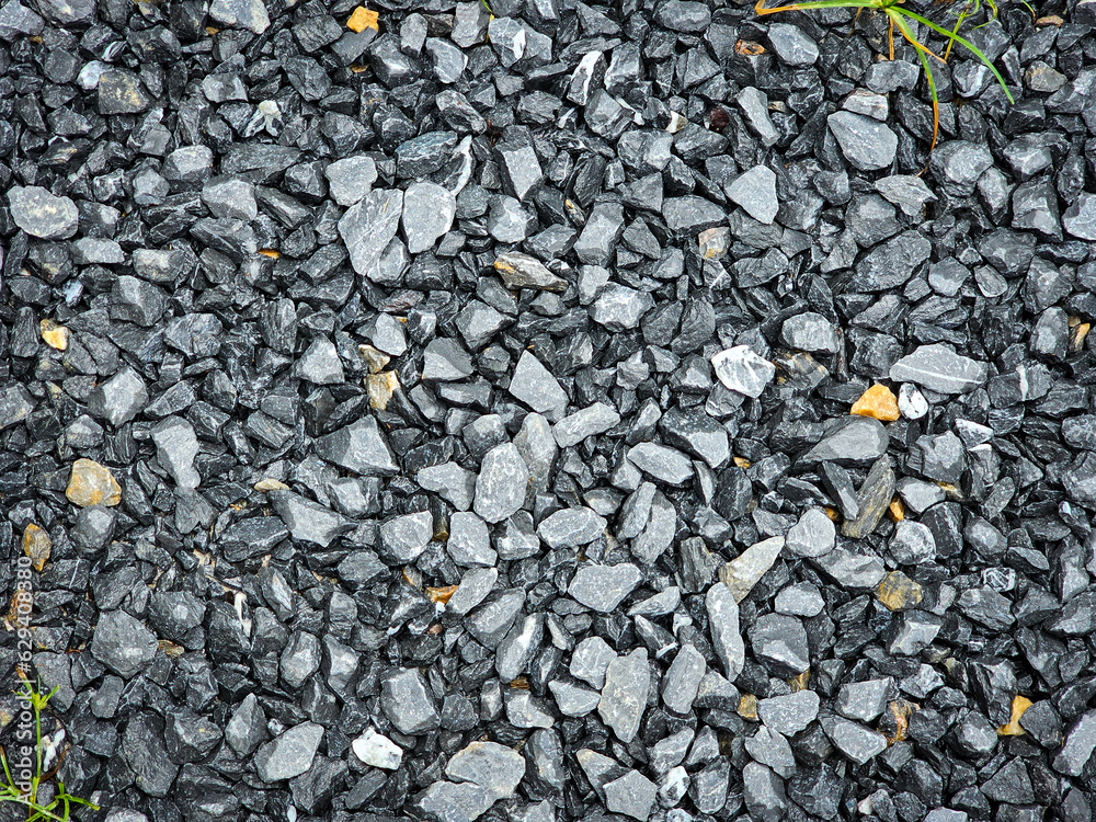 Wet gravel for structural work at the construction site background. Stone texture background Wet gravel for structural work at the construction site background. Stone texture background