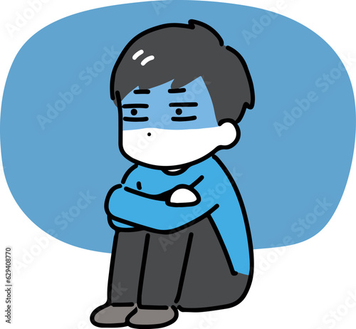 暗い顔で体育座りをしている私服の男性