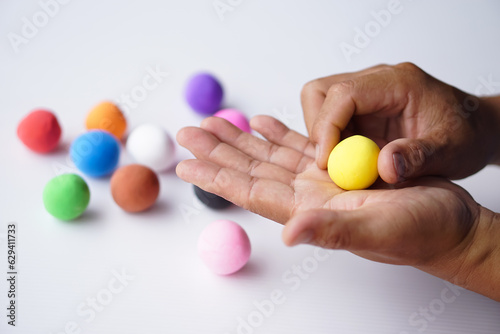 Close up hands sculpt plasticine into round shapes. Concept, alzheimer, weak muscle patients recovering activity by sculpting. Make concentration for ADHD or autistic symptom kids. Enhance imagination