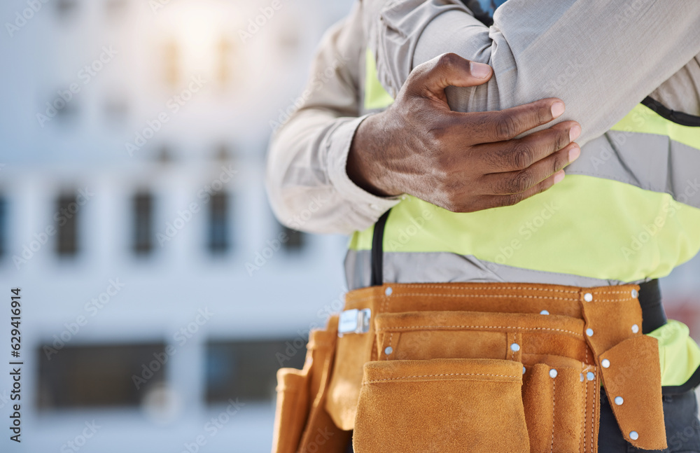 Hand, elbow and pain with a construction worker on a building site, holding a joint injury while working. Risk or problem, emergency and accident with engineer feeling arm ache during a project Hand, elbow and pain with a construction worker on a building site, holding a joint injury while working. Risk or problem, emergency and accident with engineer feeling arm ache during a project
