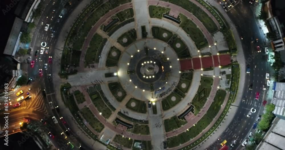 Aerial view night circular roundabout junction road with vehicle movement transport industry