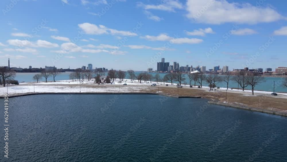 Park of Belle isle with majestic skyline view of Detroit, aerial fly forward view Park of Belle isle with majestic skyline view of Detroit, aerial fly forward view