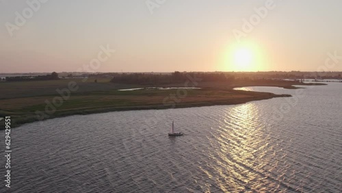 Wide shot of Sail boat on lake the fluessen Friesland with soft light, aerial photo