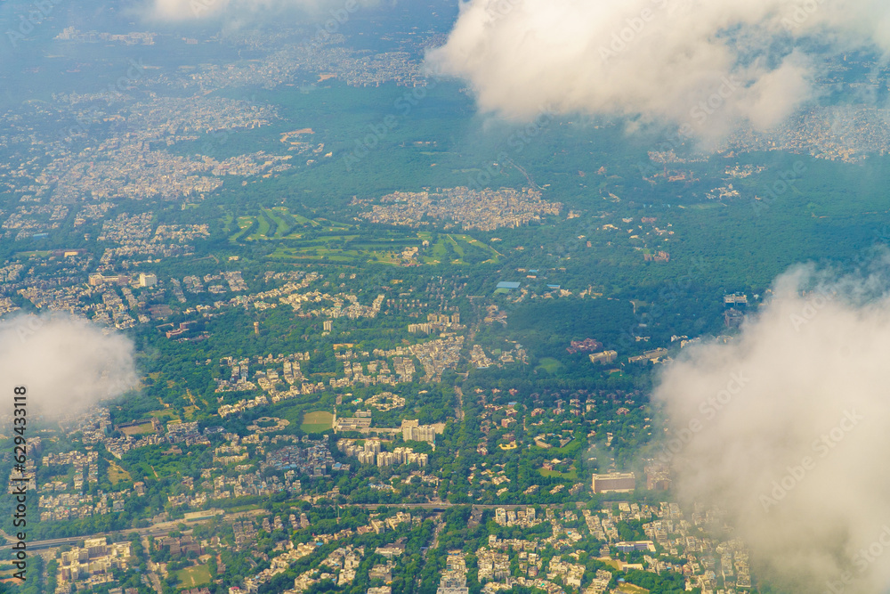 Aerial view of the city from the airplane window. View from the airplane window. New Delhi, India