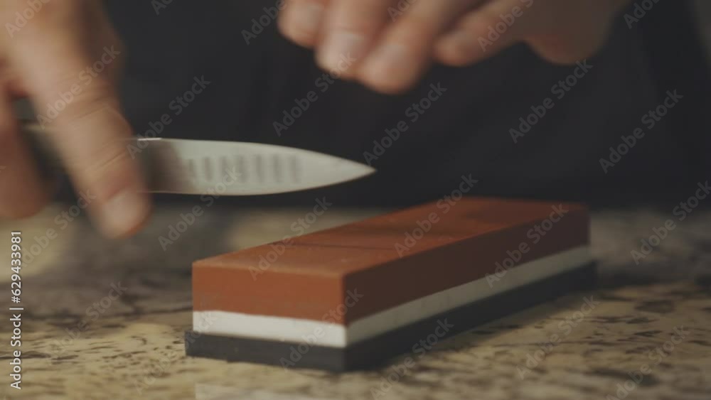 Sharpening Knife With Whetstone. closeup Sharpening Knife With Whetstone. closeup
