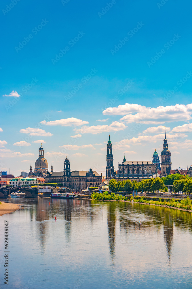 Dresden, Germany. Cover page with old city historical downtown, Elbe river at hot summer day at sunset