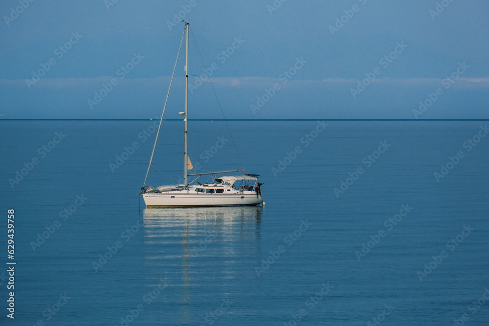 scenic view of boat floating on calm sea scenic view of boat floating on calm sea