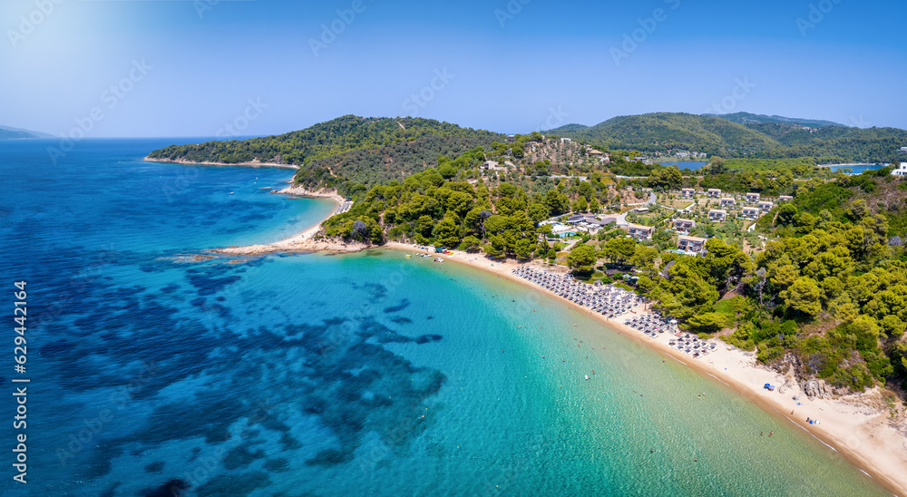 Aerial view of the popular Banana Beach at Skiathos island, Sporades, Greece, with fine sand and pristine sea