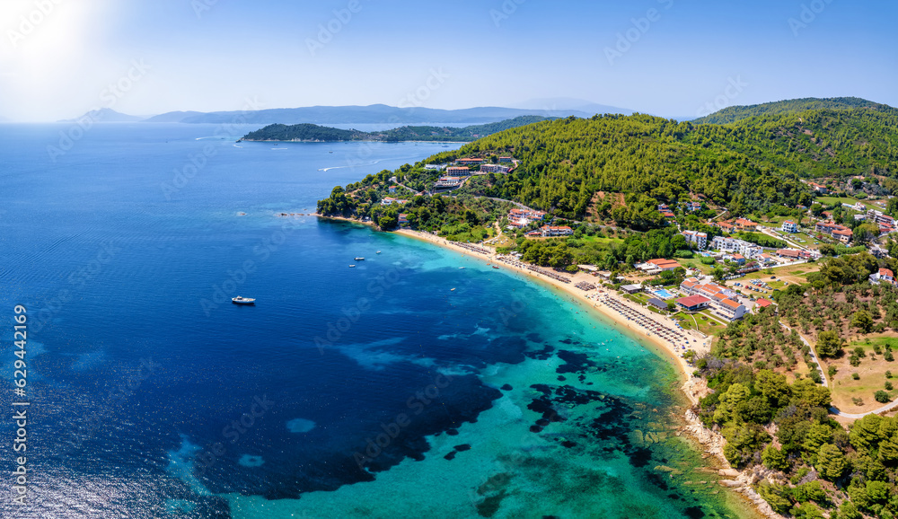 Aerial view of the beautiful coast of Skiathos island, Sporades, Greece, with the beach of Troulos and the bay of Koukounaries