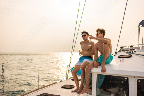 Caucasian men friend drinking champagne while having party in yacht.