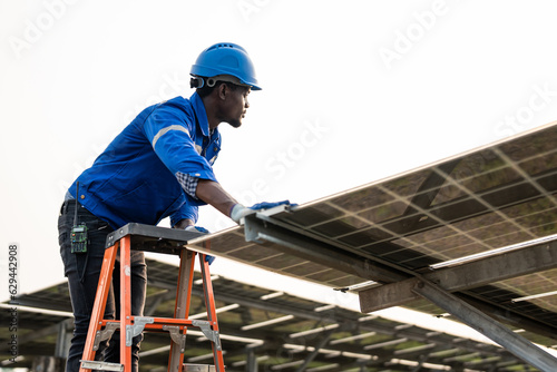 Professional engineer work to maintenance of photovoltaic panel system. © Kawee