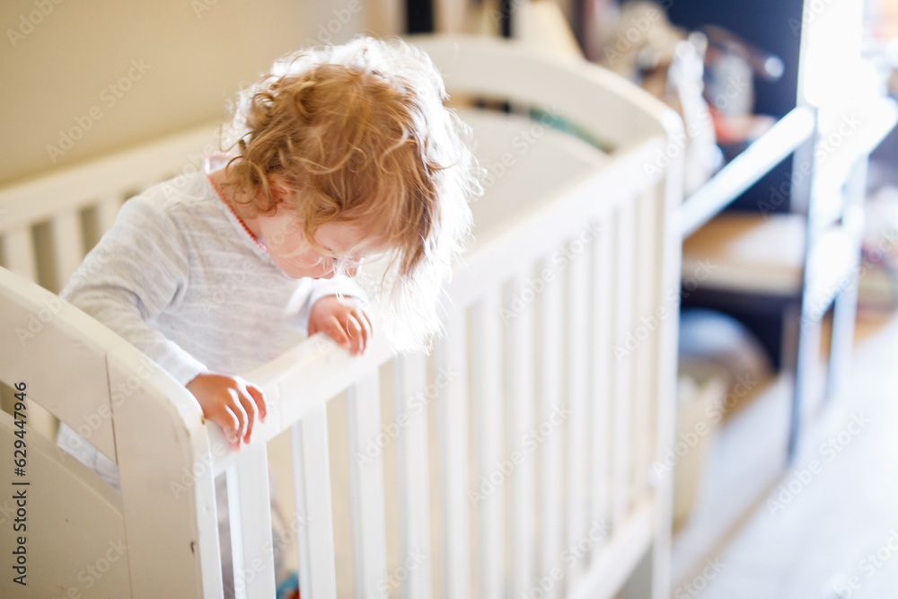 Cute Little Baby Girl Lying in Cot after Sleeping. Healthy Happy Child