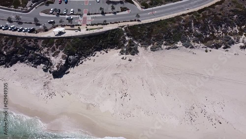 Aerial view over traffic moving and vehicles parked. Yanchep Lagoon, Australia photo