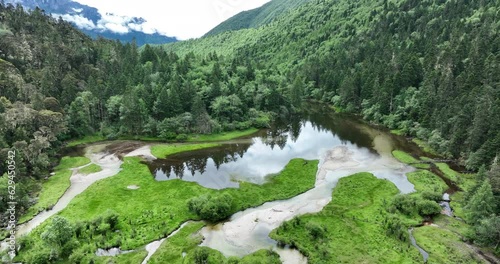 Beautiful aerial footage of high altitude forest mountain and lake landscape in Sichuan,China