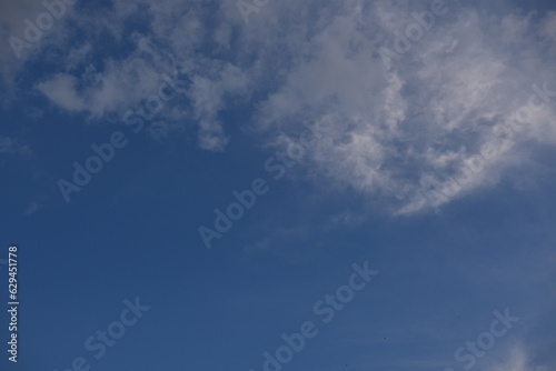 White clouds against the blue sky background summer cloudy sky, soft light blue white sky background