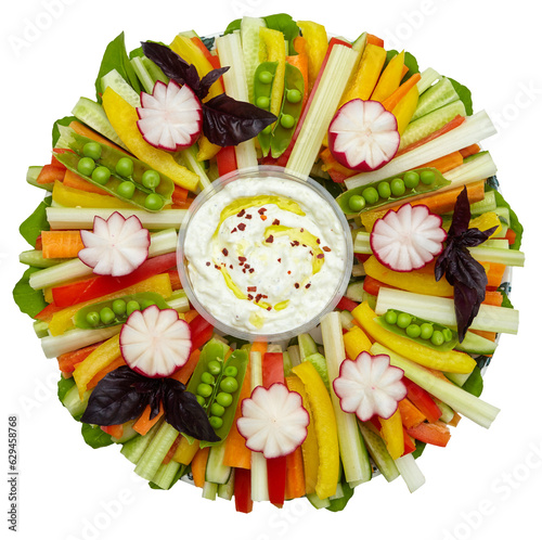 Sliced raw vegetables on a plate with white sauce. Colorful decor for a holiday table, buffet.  On transparent background. Top view